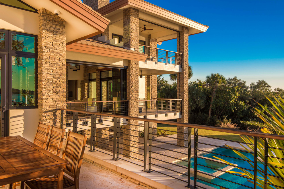 Example of a large mountain style backyard stone and custom-shaped natural hot tub design in Tampa