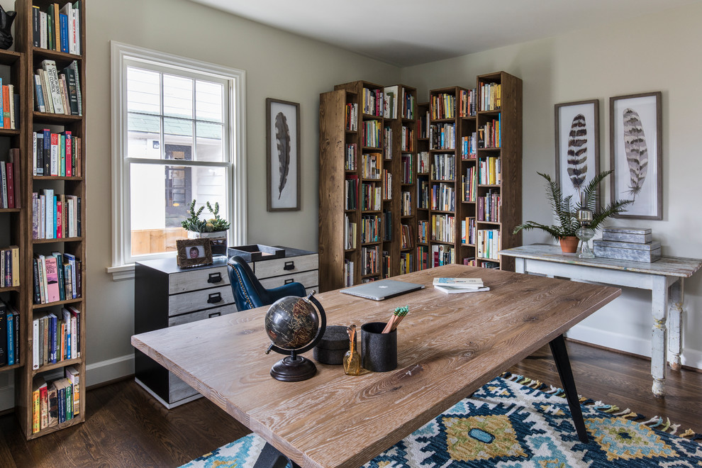 Design ideas for a mid-sized beach style home office in Portland with a freestanding desk, beige walls, dark hardwood floors, no fireplace and brown floor.