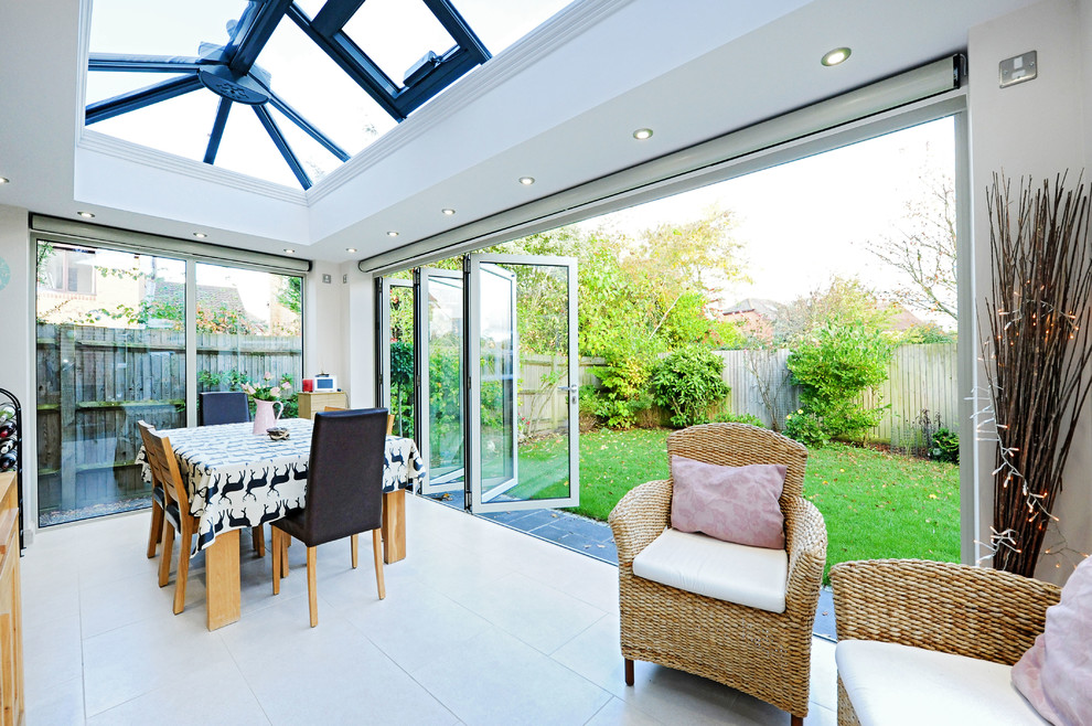 This is an example of a contemporary sunroom in Hampshire.