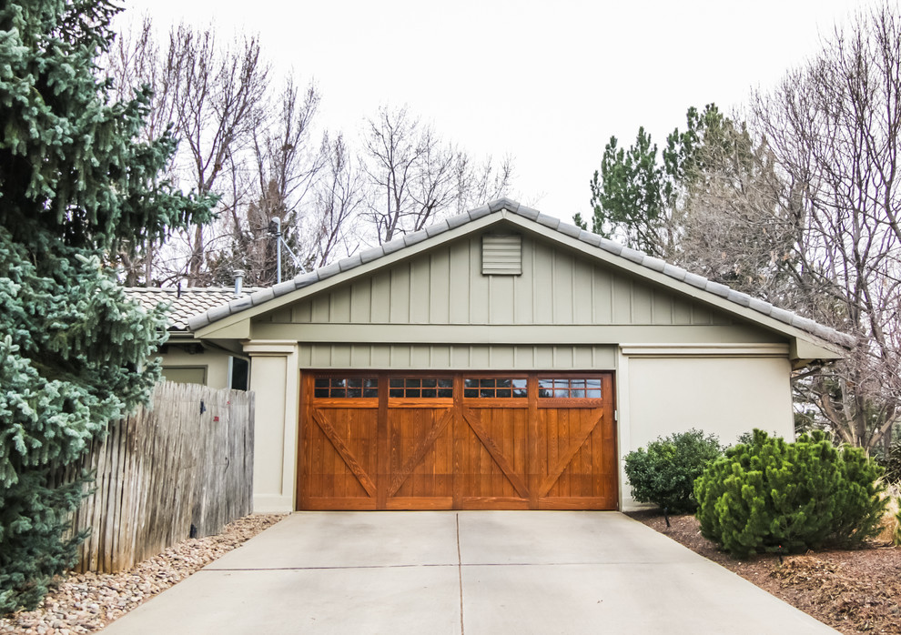 Inspiration for a mid-sized traditional detached two-car garage in Denver.