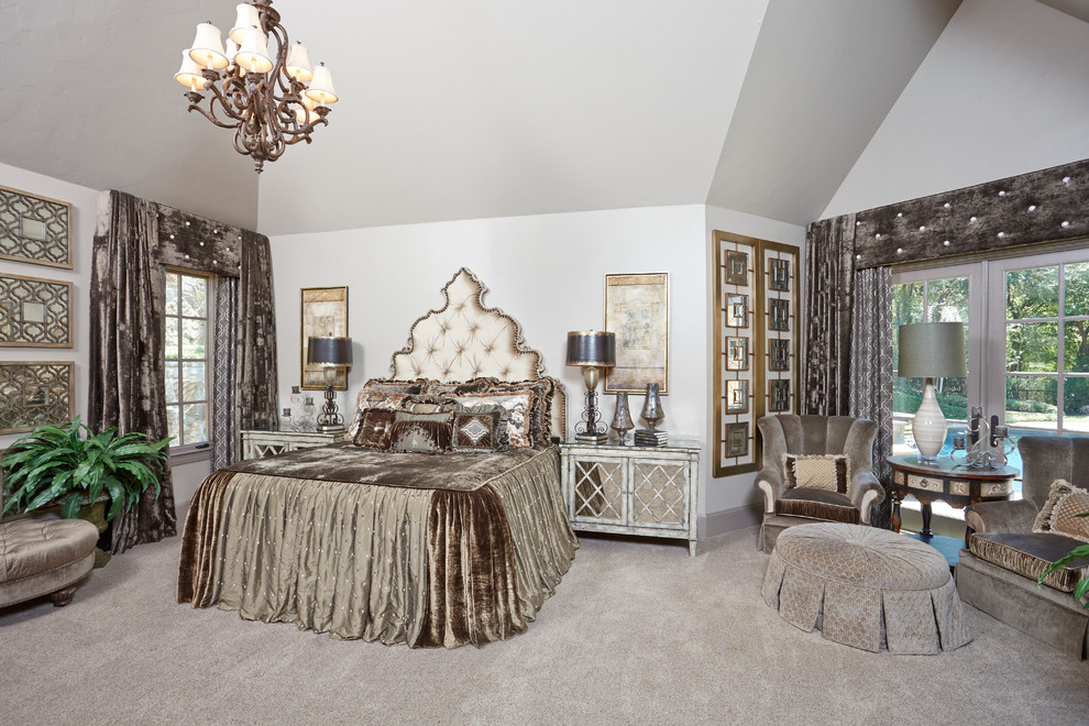 Inspiration for a large traditional master bedroom in Dallas with beige walls and carpet.