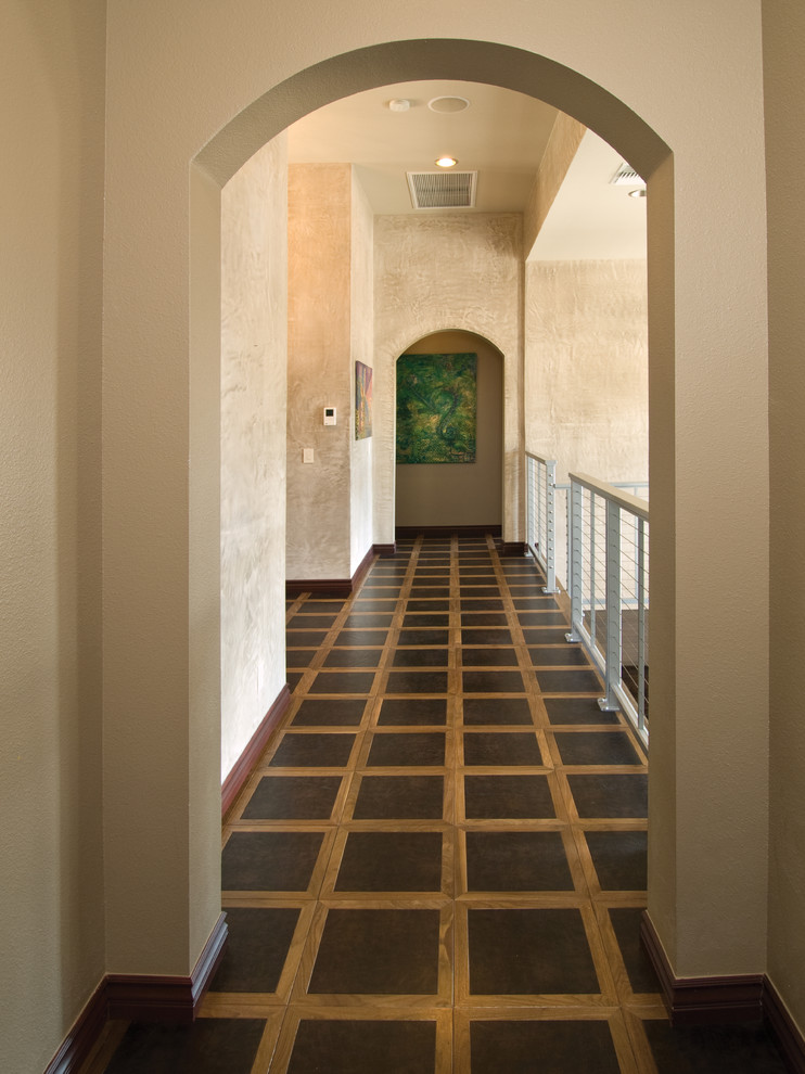 Inspiration for a mediterranean hallway with beige walls.
