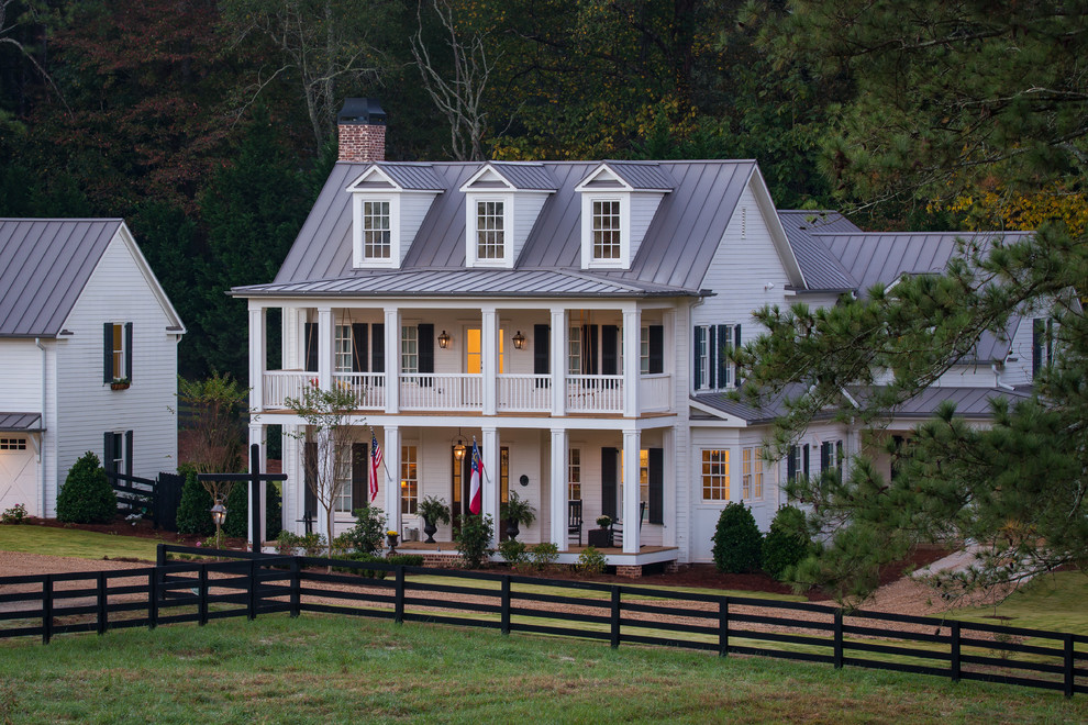 Photo of a country white exterior in Atlanta with concrete fiberboard siding.