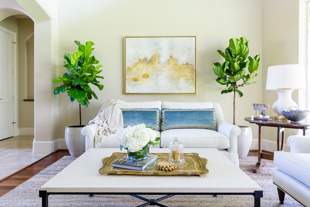 Photo of a beach style living room in Houston with beige walls, dark hardwood floors and brown floor.