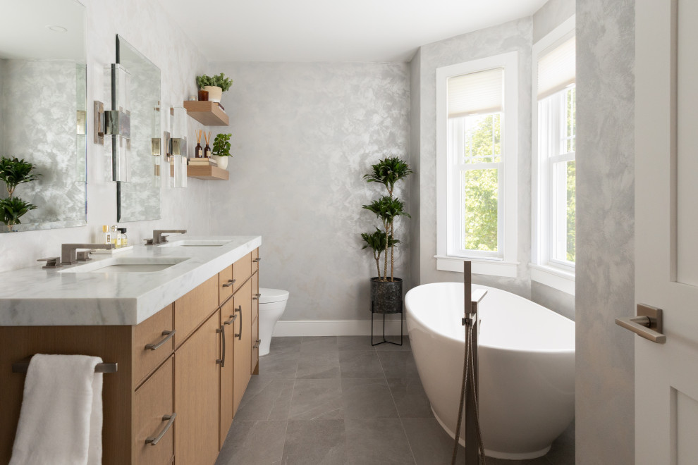 Inspiration for a contemporary freestanding bathtub remodel in Boston with a hinged shower door