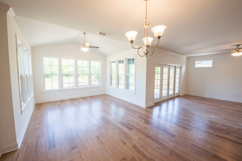 Design ideas for a mid-sized transitional sunroom in Atlanta with light hardwood floors and brown floor.