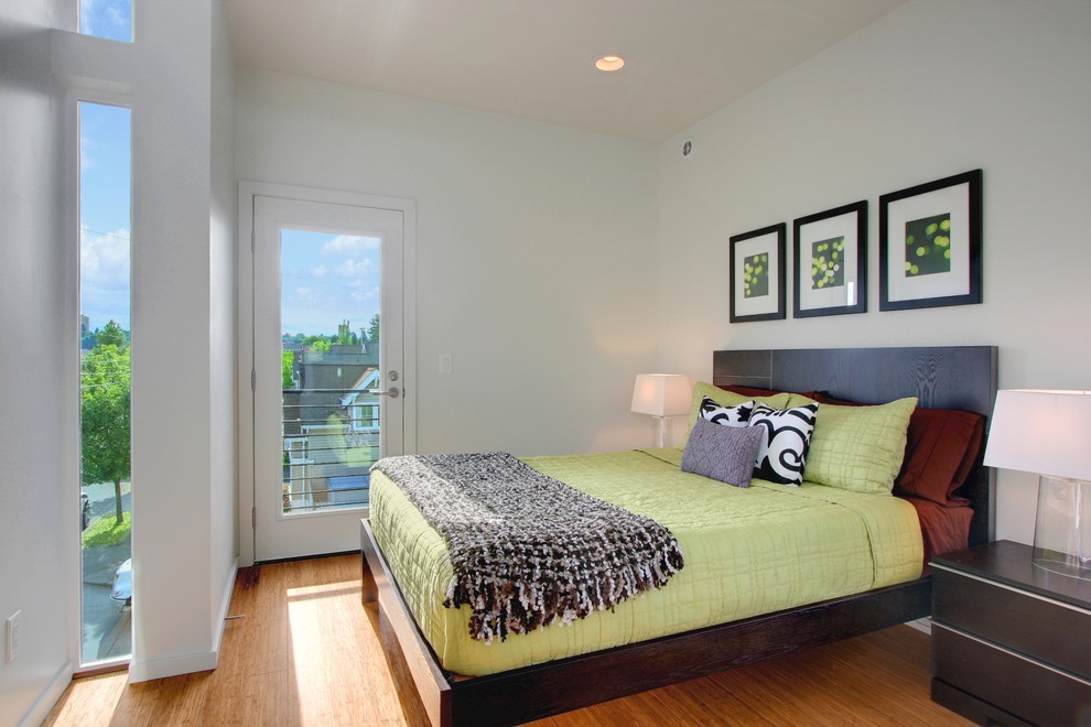 Photo of a small contemporary master bedroom in Seattle with medium hardwood floors.