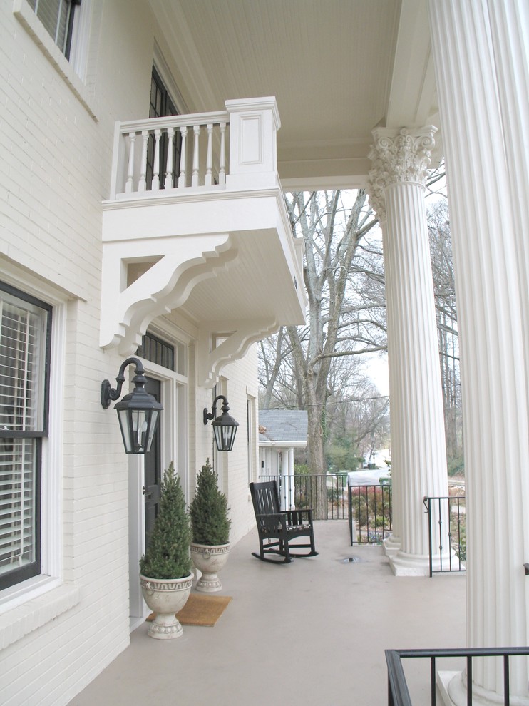 Design ideas for a mid-sized traditional three-storey brick white exterior in Atlanta with a gable roof.