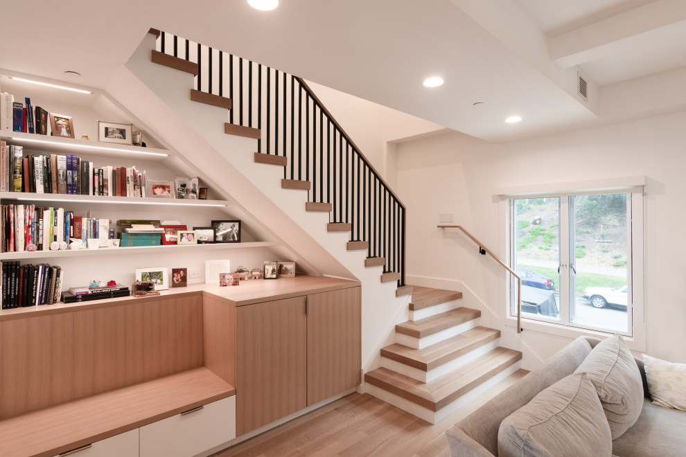 Inspiration for a mid-sized transitional wooden l-shaped metal railing staircase remodel in San Francisco with painted risers