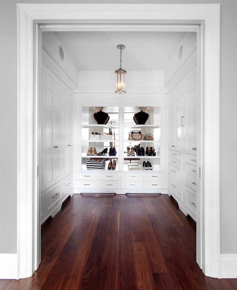 Photo of a transitional dressing room in Dallas with white cabinets.