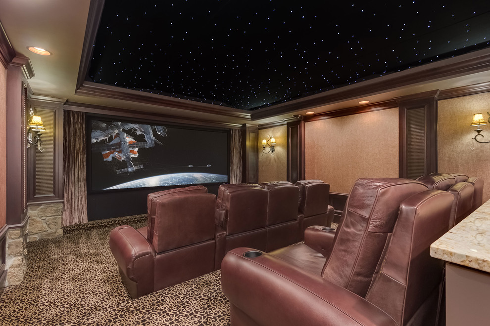 Design ideas for a mid-sized traditional enclosed home theatre in Minneapolis with beige walls, carpet, a projector screen and brown floor.