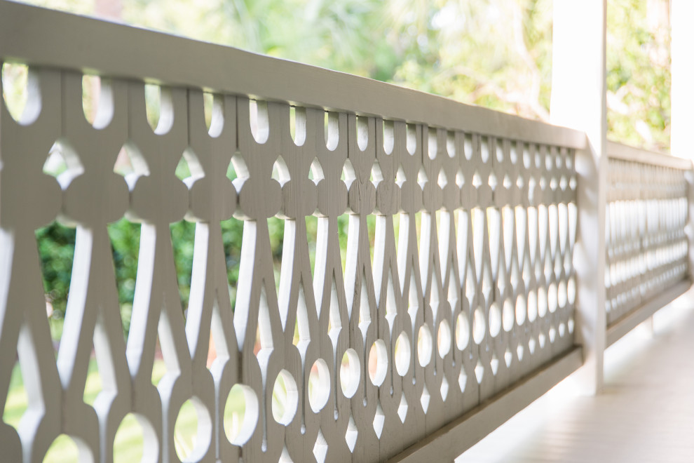 Sullivan's Island Remodel - Close-up of our custom stair railing designed to mimic the original design of the historic house