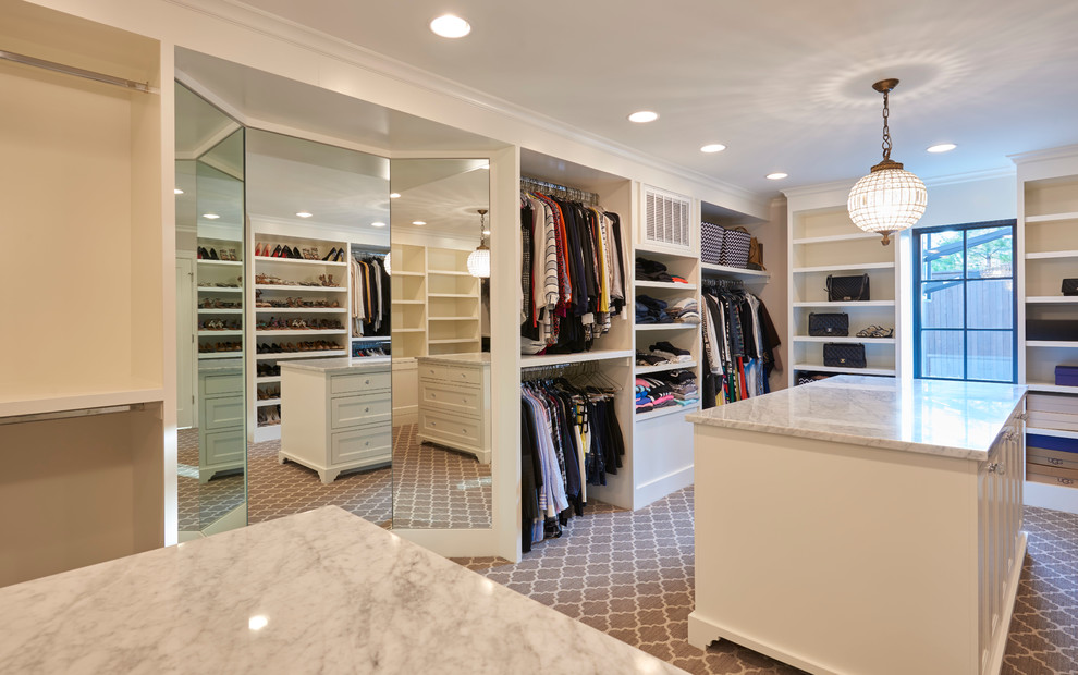 Example of a mid-sized transitional gender-neutral carpeted dressing room design with recessed-panel cabinets and medium tone wood cabinets
