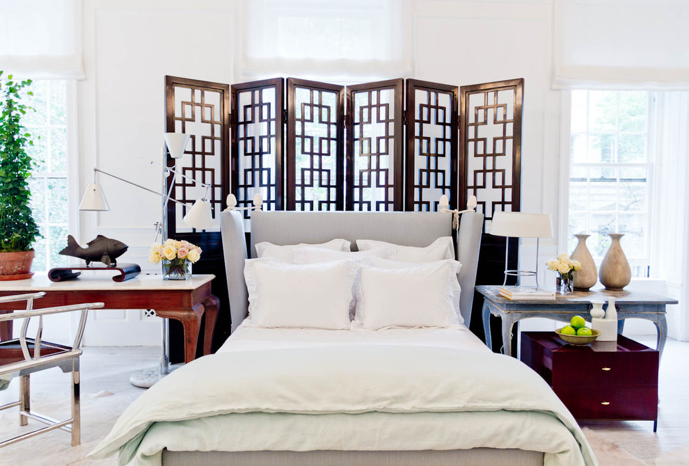 Inspiration for an eclectic bedroom in New York with white walls and carpet.