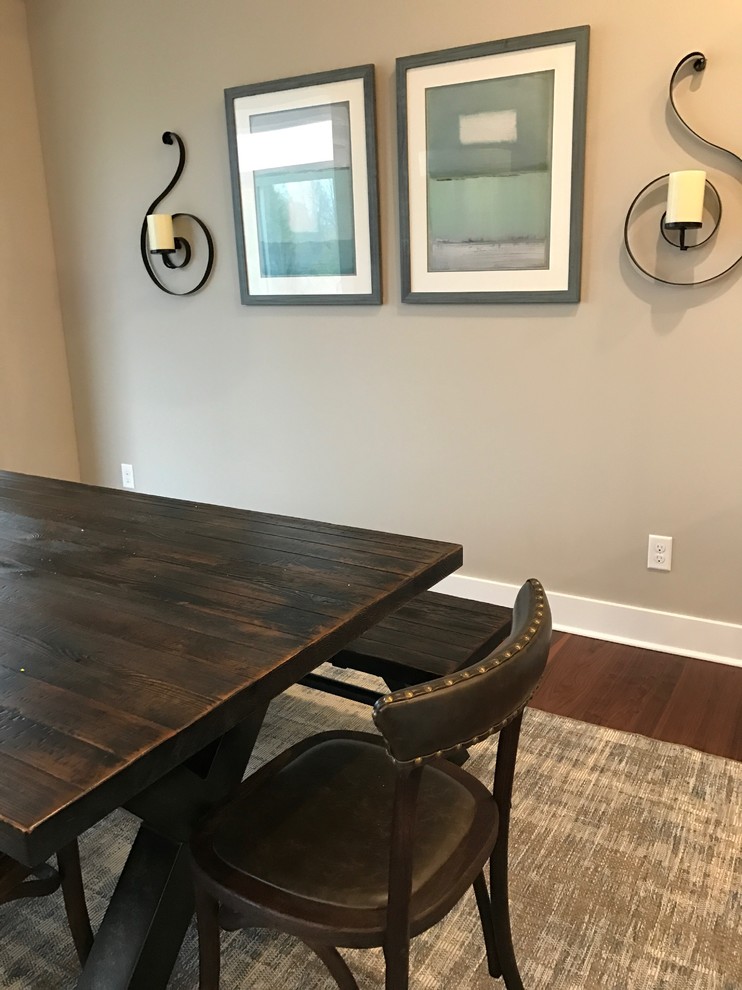 Photo of a mid-sized transitional open plan dining in Grand Rapids with beige walls, dark hardwood floors and no fireplace.
