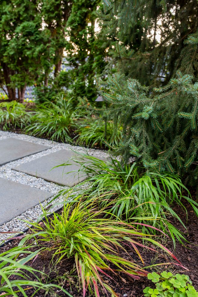 Inspiration for a large traditional backyard partial sun formal garden in Seattle with a fire feature and gravel.