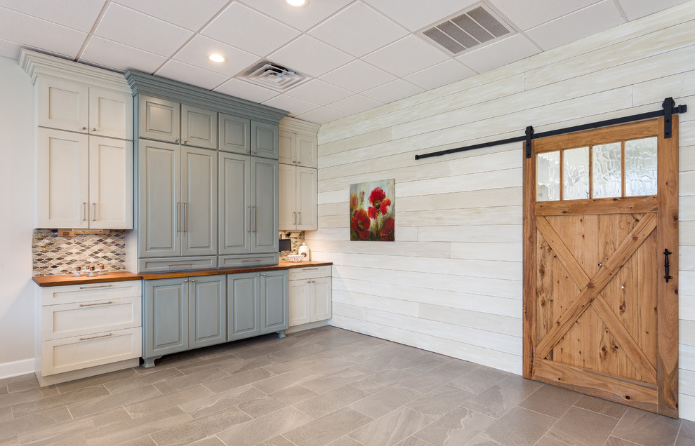 Inspiration for a large transitional porcelain tile and brown floor great room remodel with white walls and no fireplace