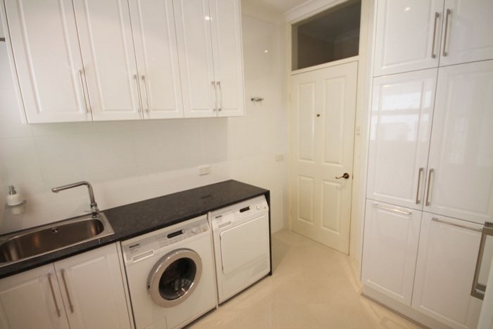 Example of a trendy laundry room design in Perth
