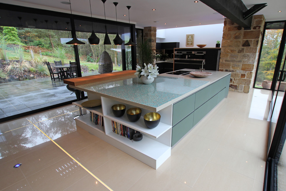 Contemporary kitchen in London with with island.