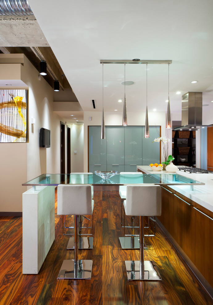 Photo of a contemporary eat-in kitchen in Charlotte with flat-panel cabinets.
