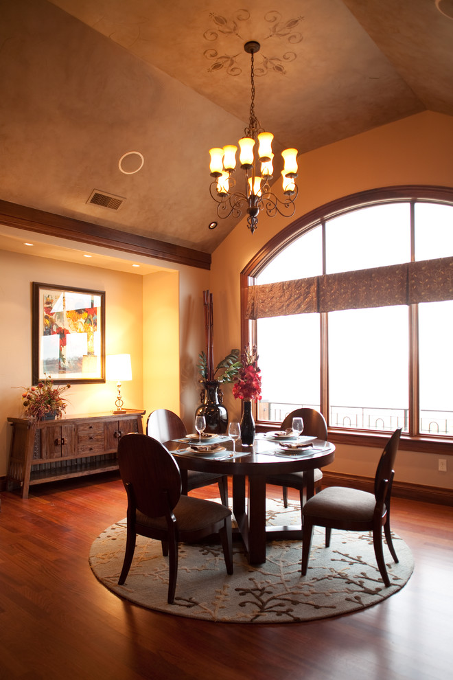 Design ideas for a contemporary dining room in Denver with beige walls and dark hardwood floors.