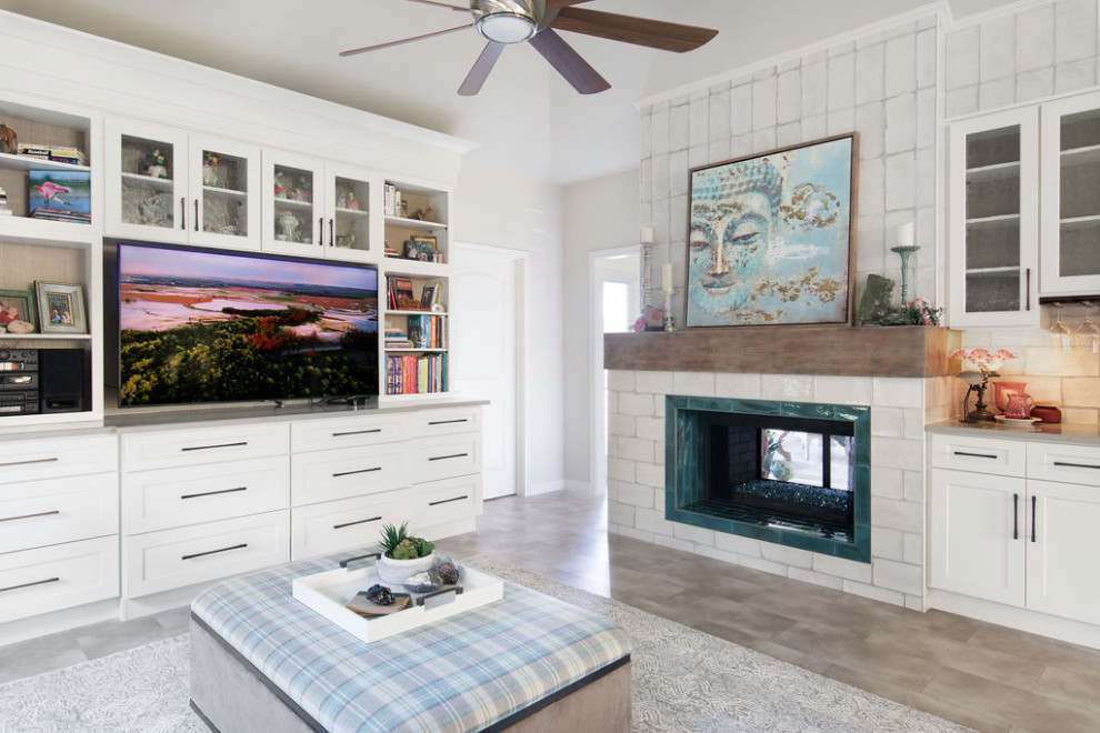 Barker Ridge Drive - Inspiration for an eclectic vinyl floor family room remodel in Austin with a two-sided fireplace, a tile fireplace and a media wall