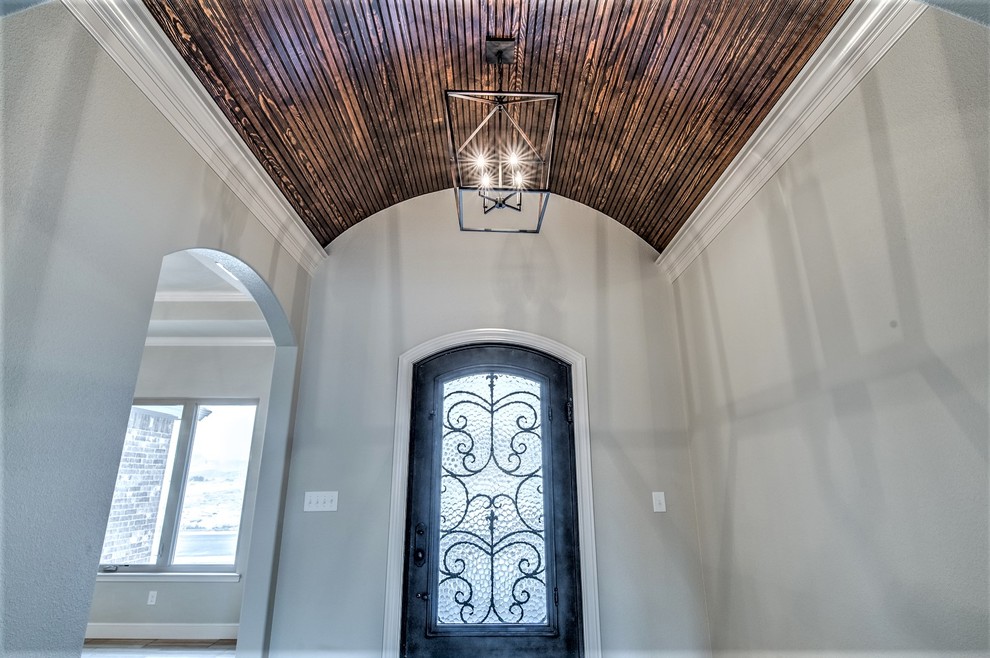 Example of a mid-sized transitional home design design in Austin
