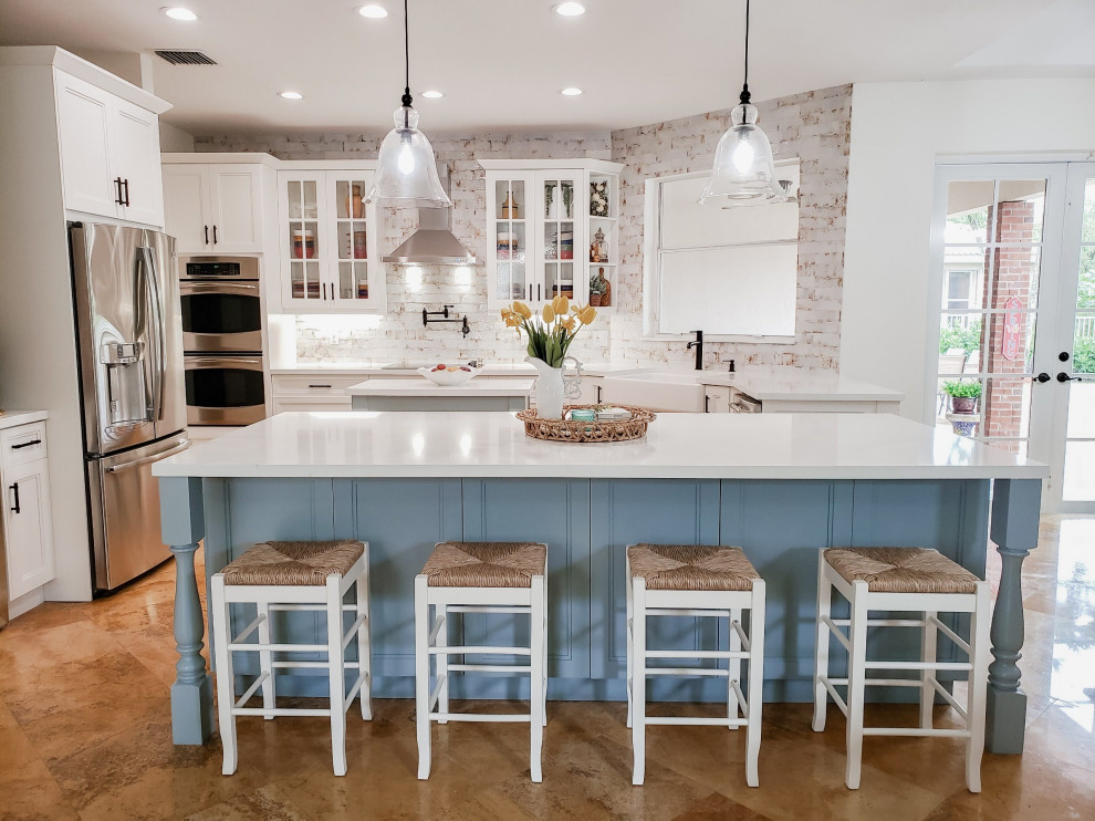 Mid-sized farmhouse open concept kitchen photo in Miami with a farmhouse sink, stainless steel appliances and white countertops