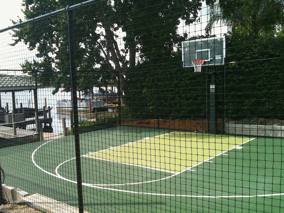 Small traditional backyard outdoor sport court in Orlando.