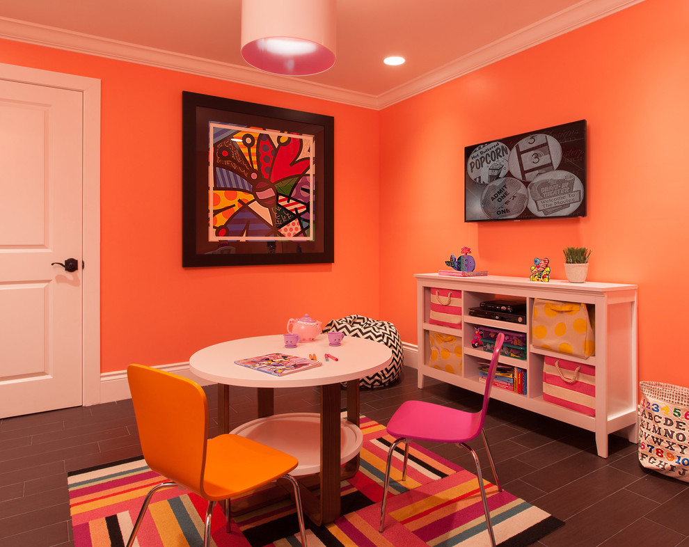 This is an example of a contemporary kids' playroom for kids 4-10 years old and girls in Miami with orange walls.
