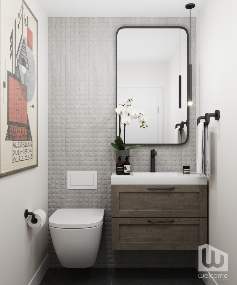 Photo of a small modern powder room in Los Angeles with recessed-panel cabinets, dark wood cabinets, a wall-mount toilet, gray tile, cement tile, grey walls, an undermount sink, engineered quartz benchtops, black floor, white benchtops and a floating vanity.