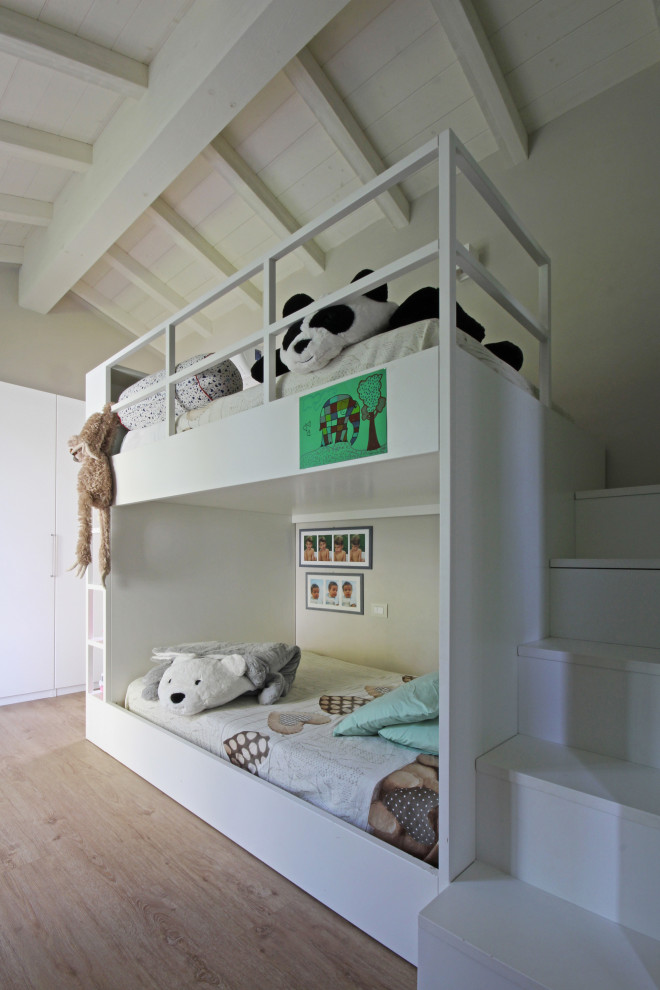 Design ideas for a country kids' bedroom in Milan with grey walls, light hardwood floors, beige floor, exposed beam, timber and vaulted.