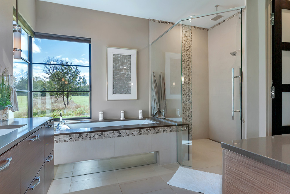 This is an example of a small contemporary master bathroom in Minneapolis with open cabinets, dark wood cabinets, an undermount tub, an open shower, a wall-mount toilet, stone tile, grey walls, ceramic floors, a vessel sink, granite benchtops, beige floor and a hinged shower door.