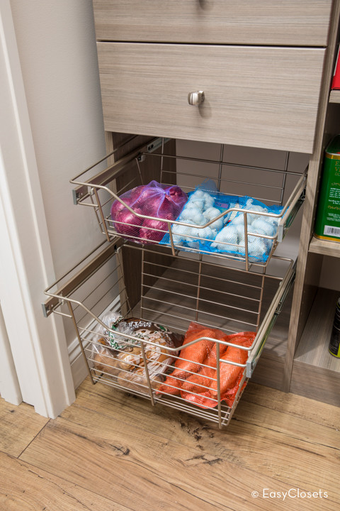 Inspiration for a contemporary kitchen pantry remodel in Grand Rapids