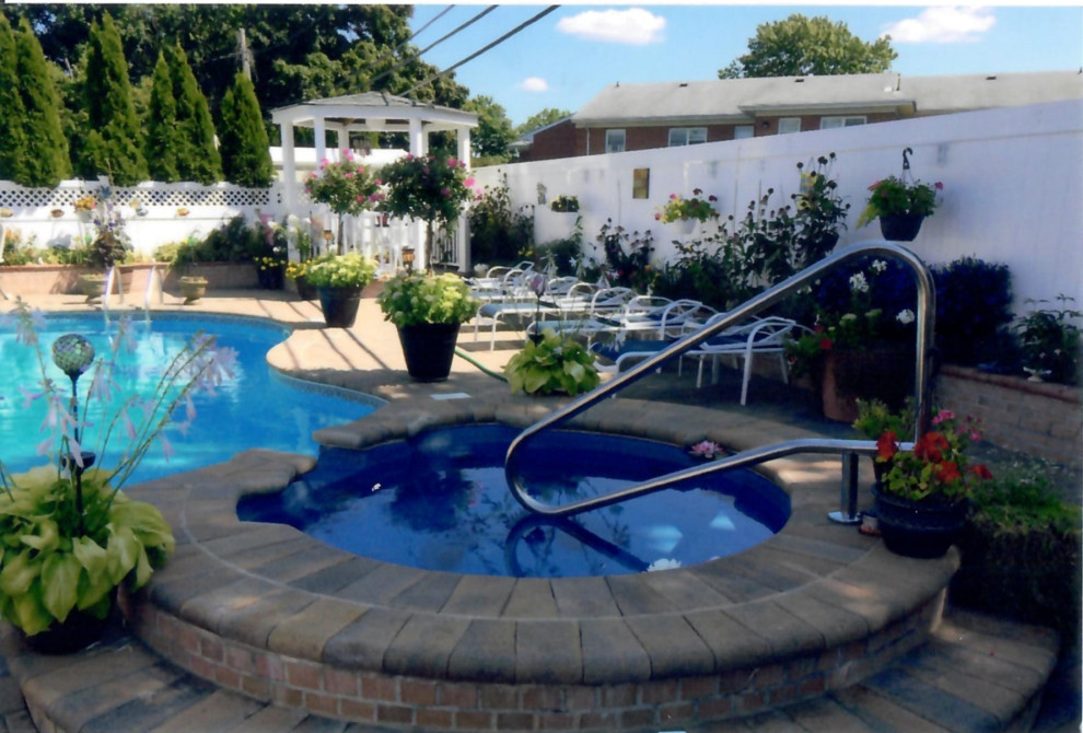 Pool with Whirl pool spill over, outdoor kitchen, outdoor bar, Pergola& Patio