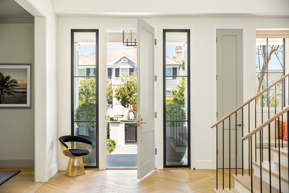 Photo of a transitional entryway in Los Angeles with beige walls and a single front door.