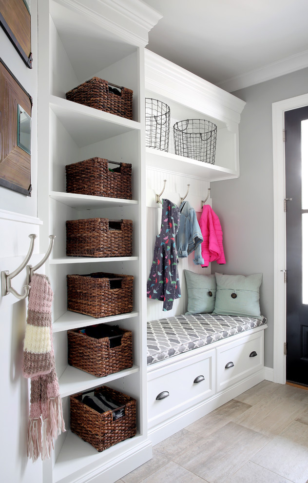 Mudroom - small traditional mudroom idea in Chicago with gray walls