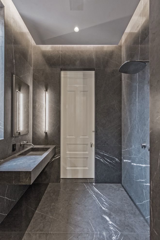 Design ideas for a small modern 3/4 bathroom in New York with grey cabinets, an open shower, gray tile, stone slab, grey walls, marble floors, a wall-mount sink, marble benchtops, grey floor, an open shower and grey benchtops.