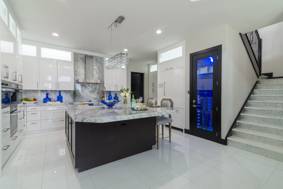 Design ideas for a large contemporary l-shaped open plan kitchen in Miami with flat-panel cabinets, white cabinets, marble benchtops, multi-coloured splashback, stone slab splashback, stainless steel appliances, ceramic floors and with island.