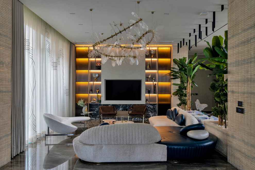 Inspiration for a contemporary living room in Mumbai With Beige Walls, a Wall-mounted TV and Gray.