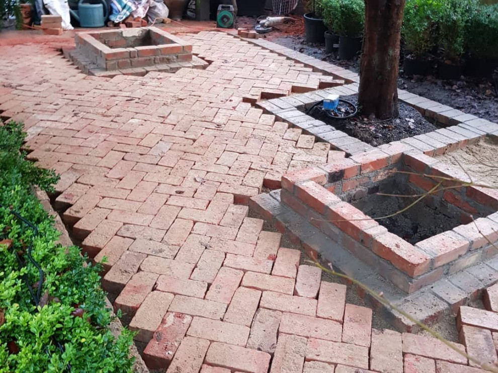 Mid-sized traditional backyard partial sun formal garden in Buckinghamshire with brick pavers for summer.
