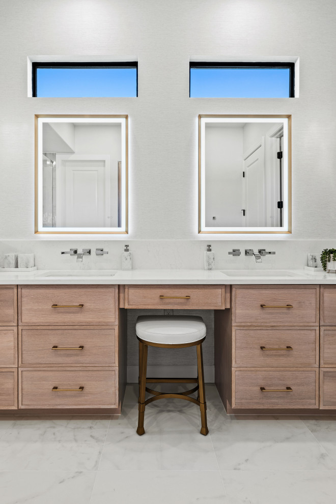 Transitional master gray tile and porcelain tile porcelain tile, white floor and double-sink walk-in shower photo with shaker cabinets, light wood cabinets, a two-piece toilet, white walls, an undermount sink, quartz countertops, white countertops, a niche and a built-in vanity