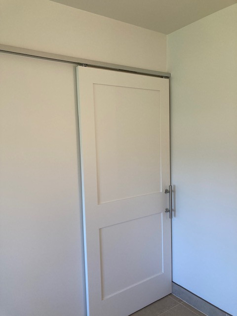 Birmingham minimal white master bath