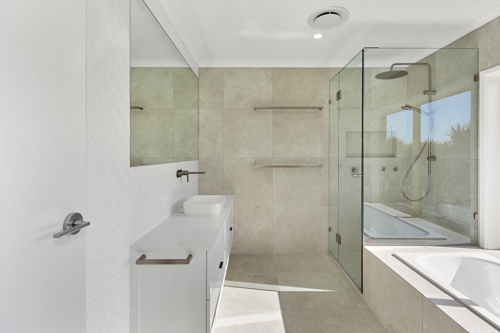 Design ideas for a medium sized contemporary shower room bathroom in Geelong with white cabinets, a corner bath, a corner shower, beige tiles, beige walls, ceramic flooring, a hinged door, white worktops, a single sink and a built in vanity unit.