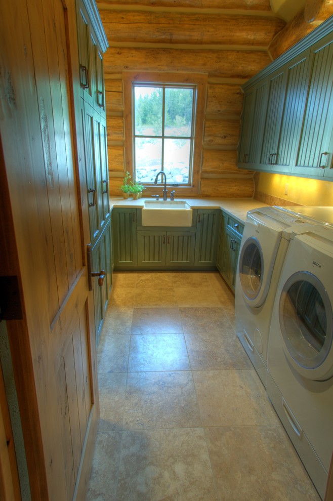 Inspiration for a country u-shaped laundry room in Other with a farmhouse sink, quartzite benchtops, ceramic floors, a side-by-side washer and dryer, beige floor, recessed-panel cabinets, green cabinets and yellow walls.