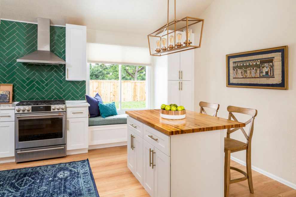 Small transitional l-shaped eat-in kitchen in Denver with a single-bowl sink, shaker cabinets, white cabinets, quartzite benchtops, green splashback, glass tile splashback, stainless steel appliances, light hardwood floors, with island, beige floor, yellow benchtop and vaulted.