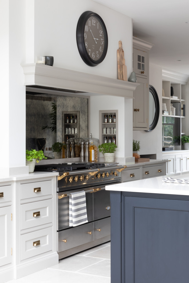 This is an example of a transitional kitchen in Surrey.