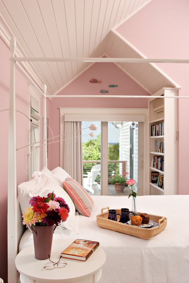 Inspiration for a beach style bedroom in Boston with pink walls.