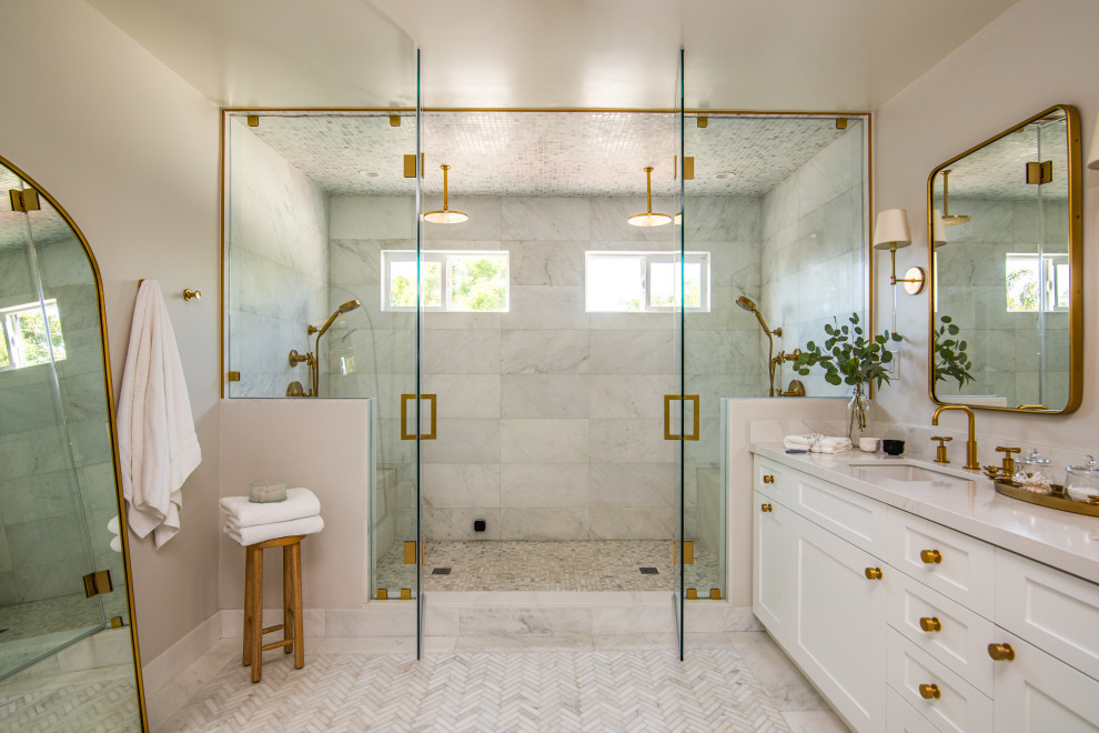 Inspiration for a large beach style master wet room bathroom in Los Angeles with white cabinets, white tile, marble, grey walls, marble floors, an undermount sink, engineered quartz benchtops, white floor, a hinged shower door, white benchtops, a shower seat, a double vanity, a built-in vanity and shaker cabinets.