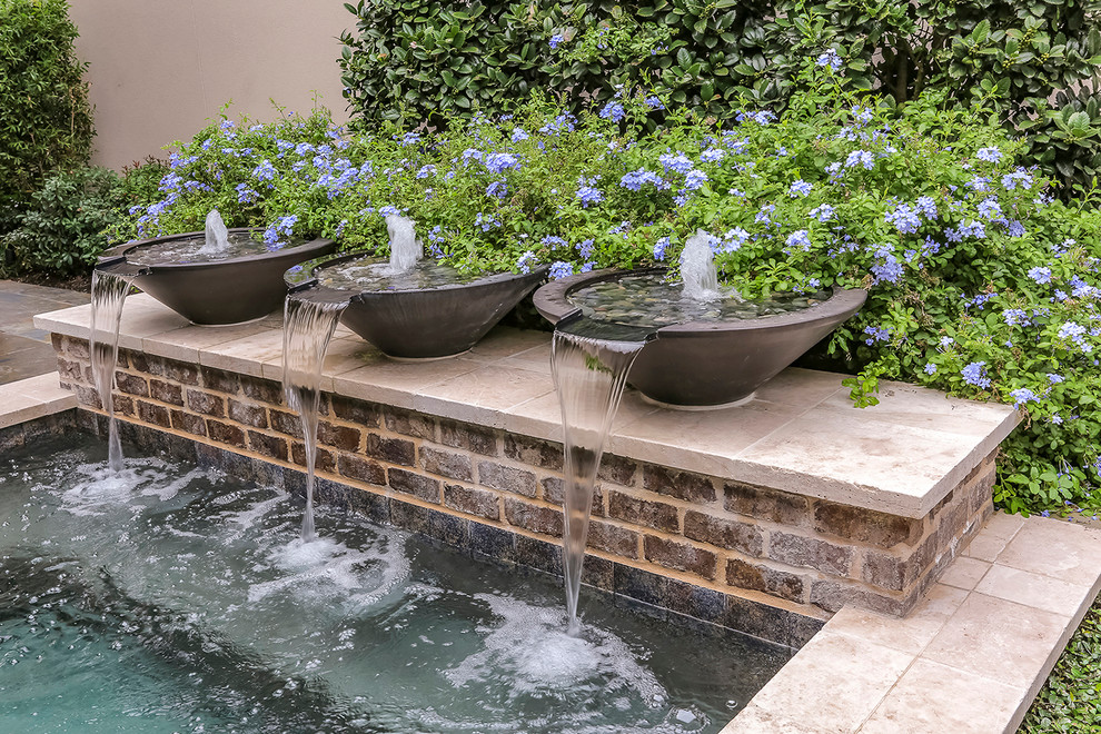 Example of a small trendy courtyard rectangular and tile hot tub design in Houston